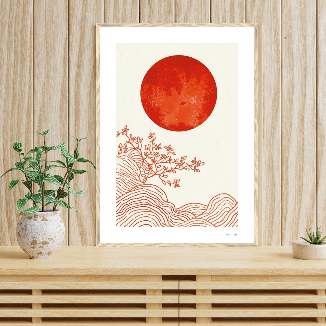 Pintura abstracta minimalista, estilo Japandi, enmarcado en madera natural con un gran círculo o sol de color terracota o marrón rojizo en el centro, y trazos sutiles en blanco y beige en estantería tamaño 50x70 cm
